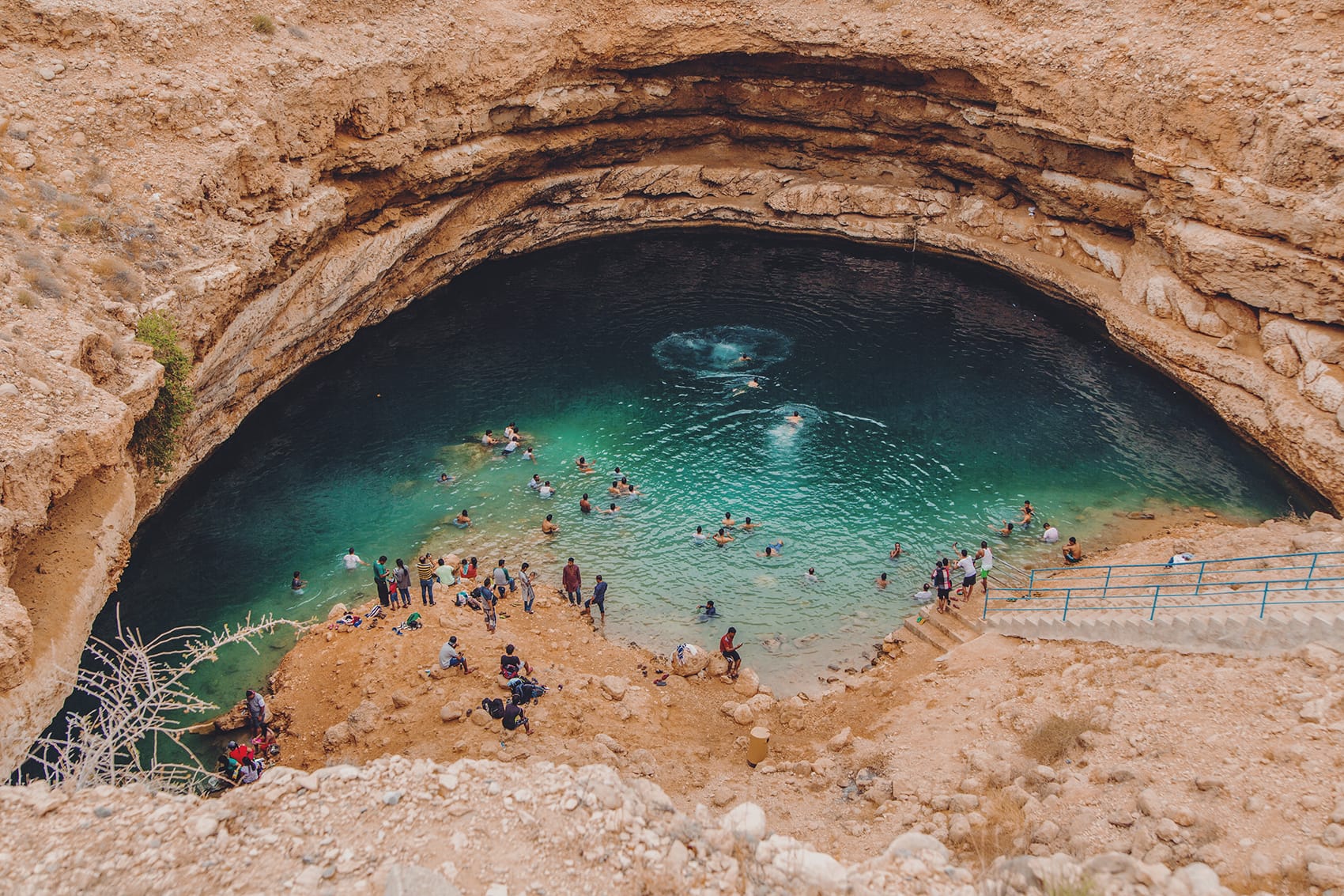 people swimming inside bimmah sinkhole