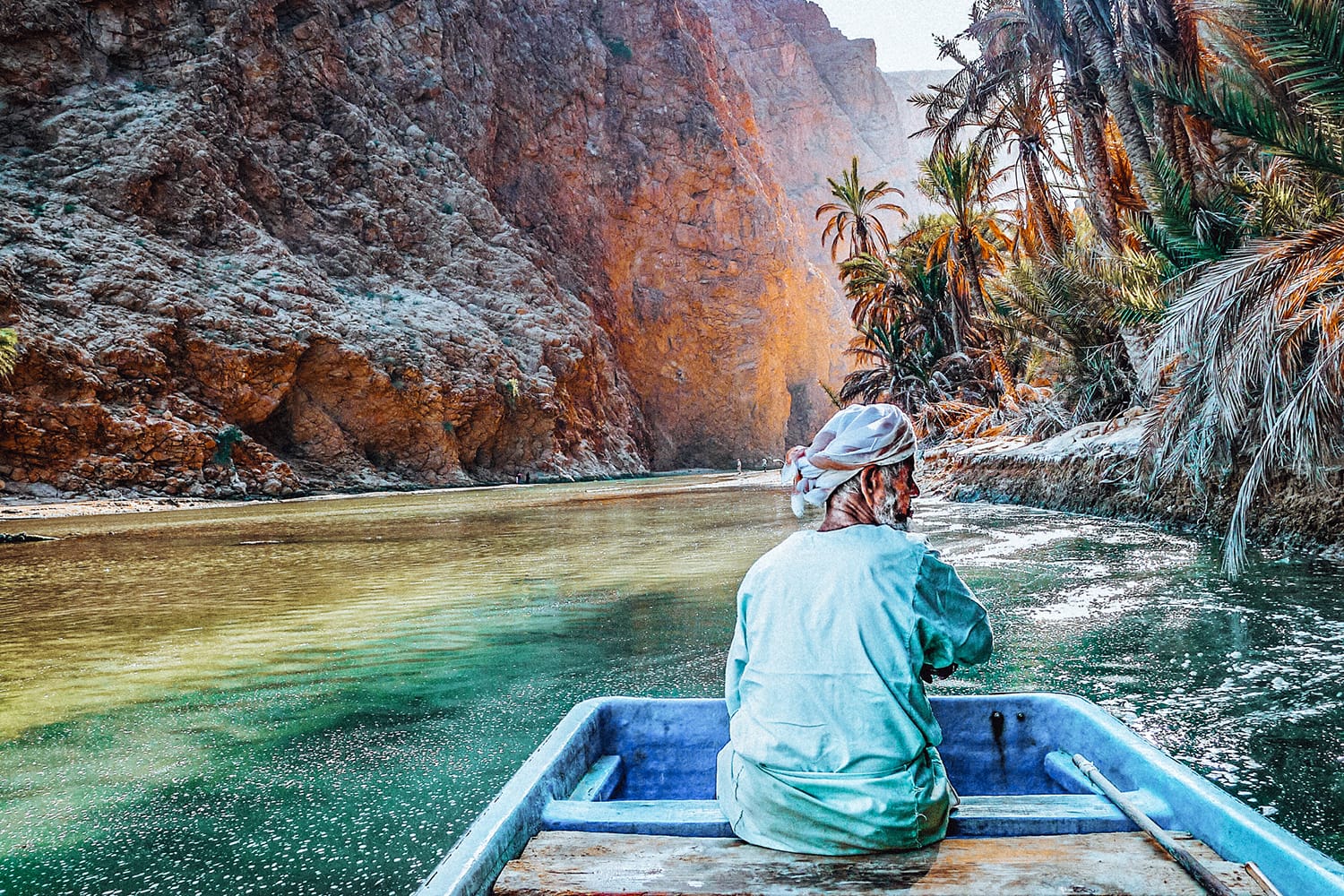 man on a boat in wadi shab
