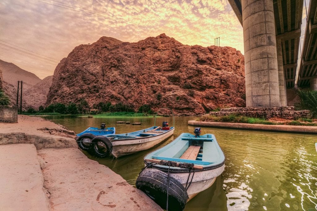 wadi shab boats by the river