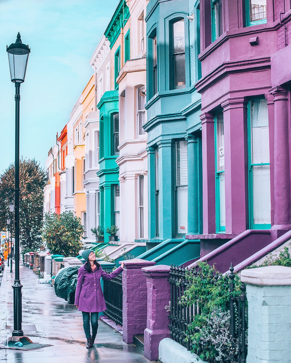 a girl wandering around the colorful streets of notting hill in london