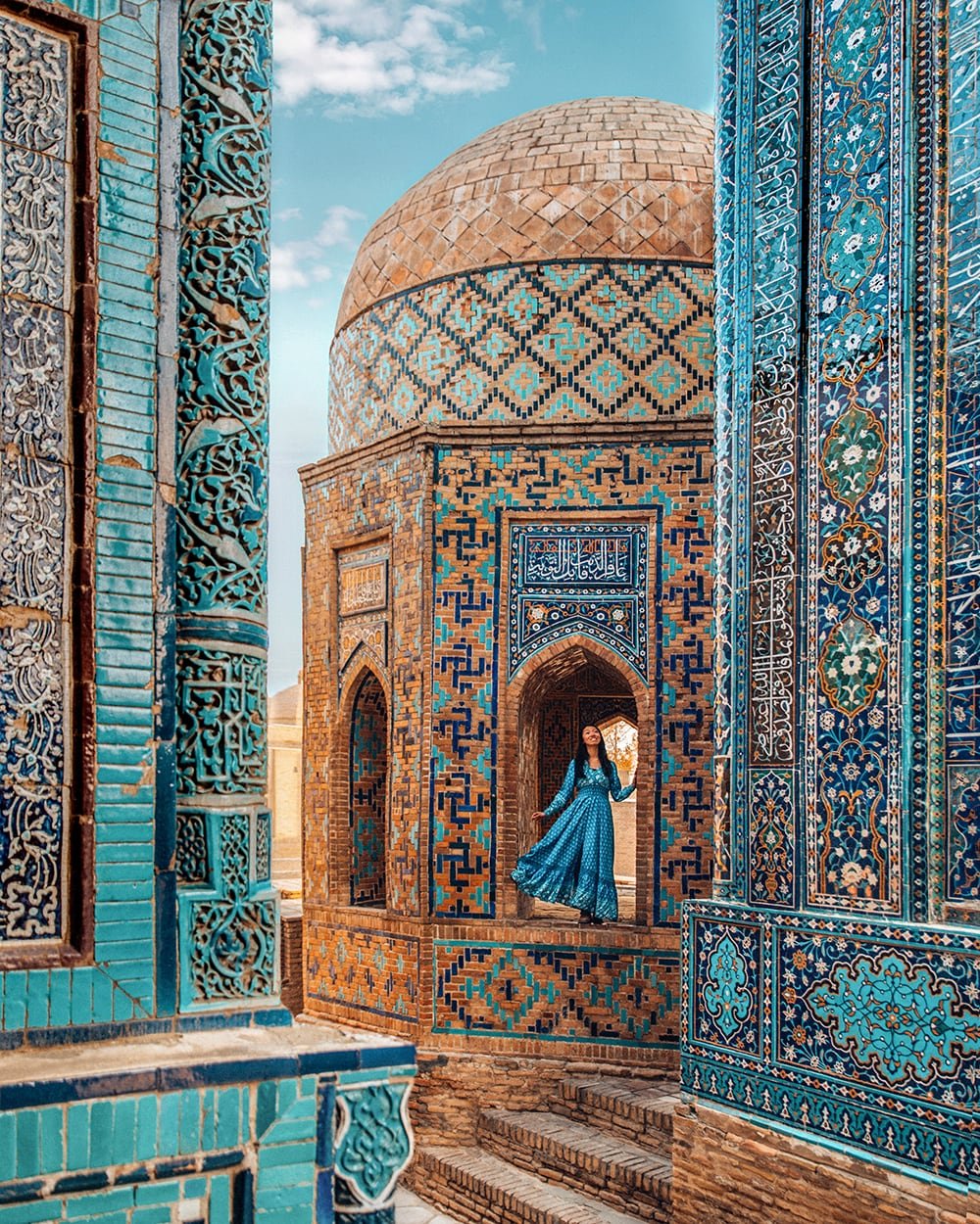 girl standing in shah i zinda mausoleums in samarkand uzbekistan