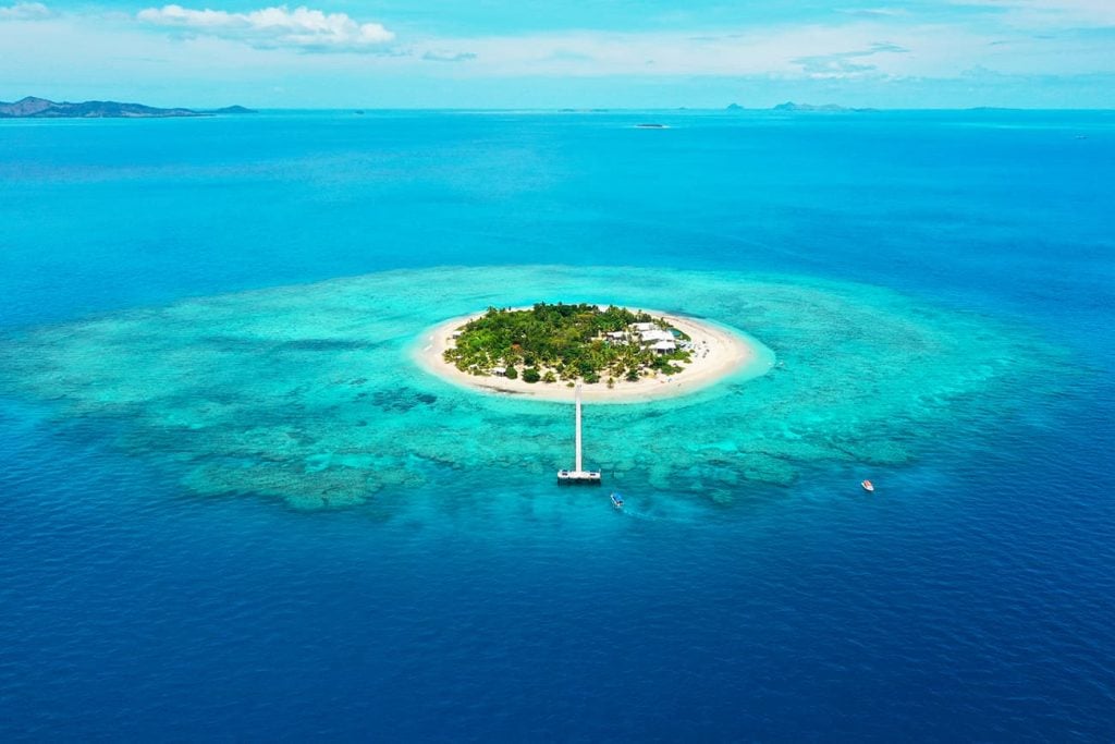 A Island Surrounded by Clear Blue Water in Fiji