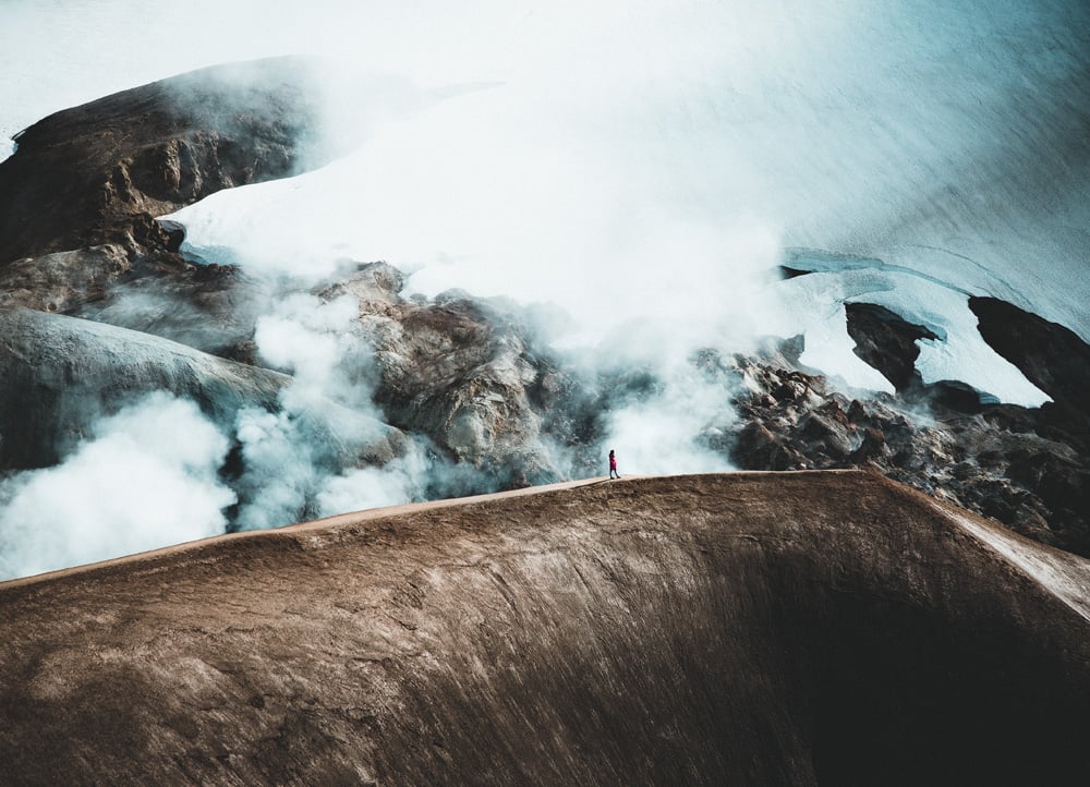 A Man Walking on a Mountain