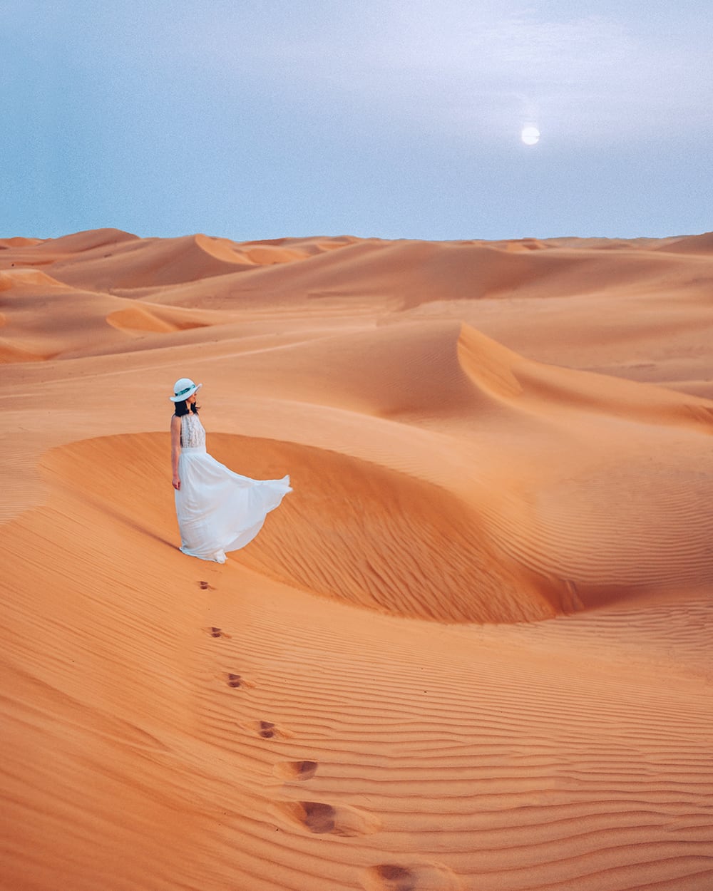 A Girl Standing on a Desert in Oman