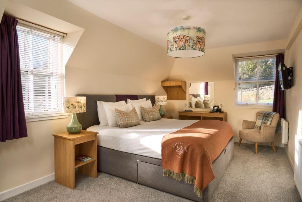 a bedroom with a bed and a lamp
