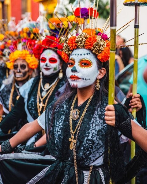A Group of People Wearing Day of the Dead Costumes