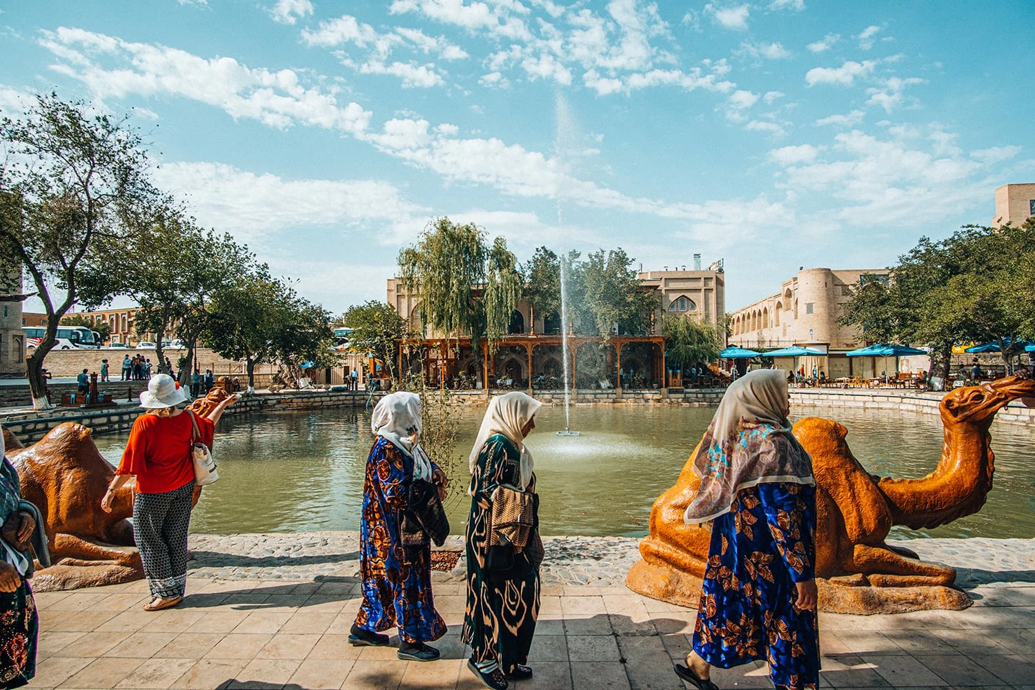 uzbekistan LYABI-HAUZ SQUARE pond locals walking by