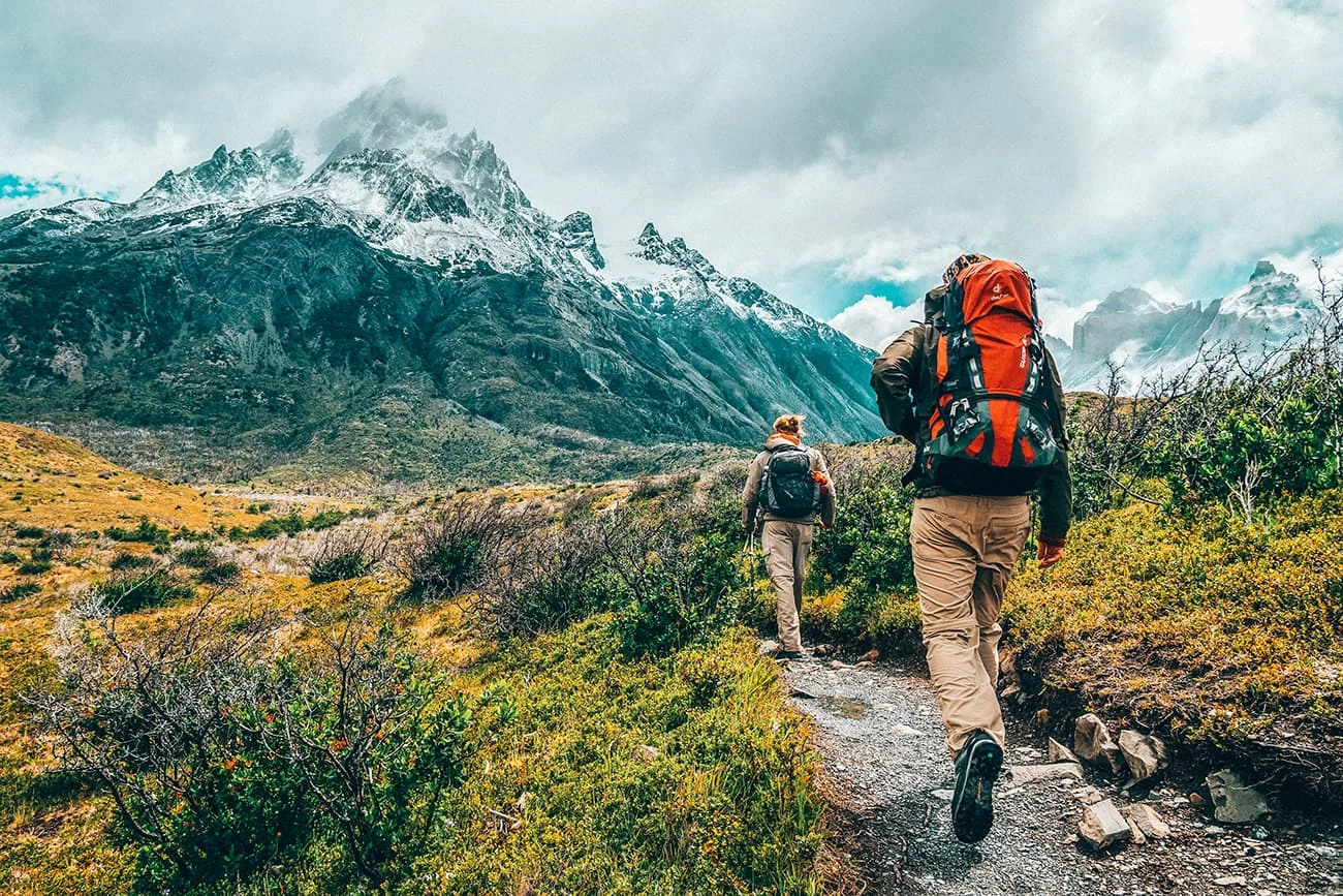 Hikers Hiking Up a Snowy Mountain